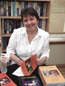 Kim Osborne signing her books 'Furry Tales for Little People'
