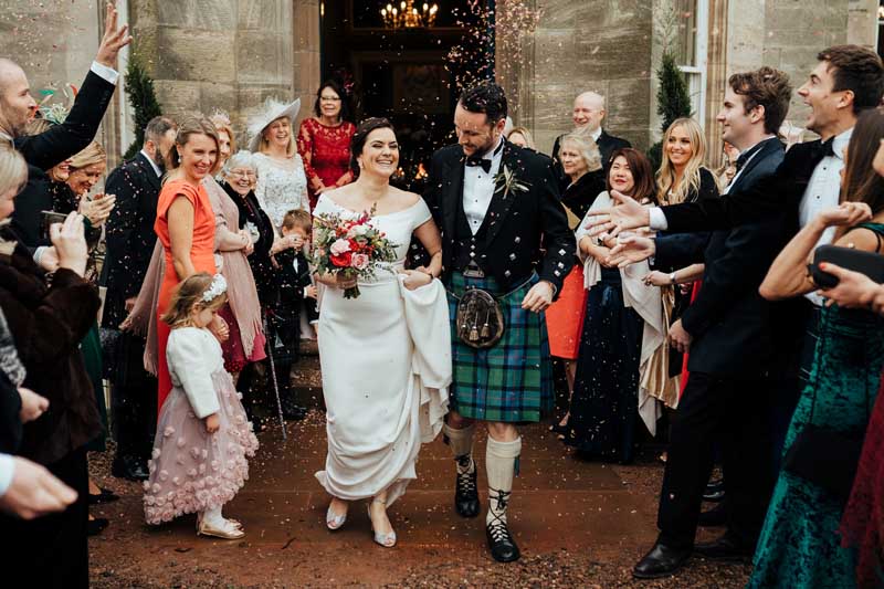 Wedding Couple & Confetti Outside Winton Castle