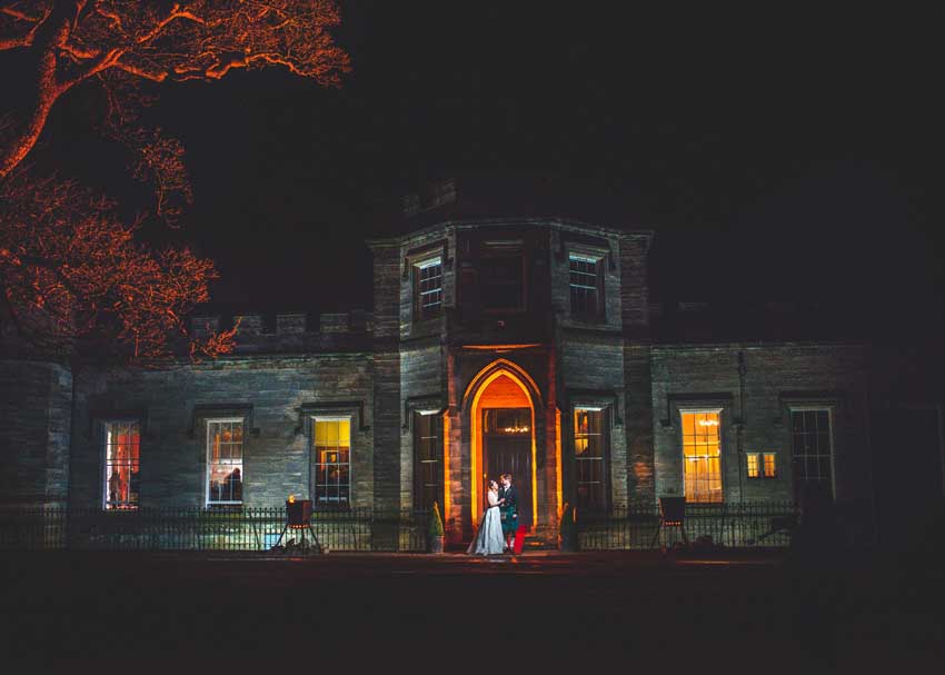 AAP_Ross&Rachel Wedding_Lit by Winton Castle Front Door