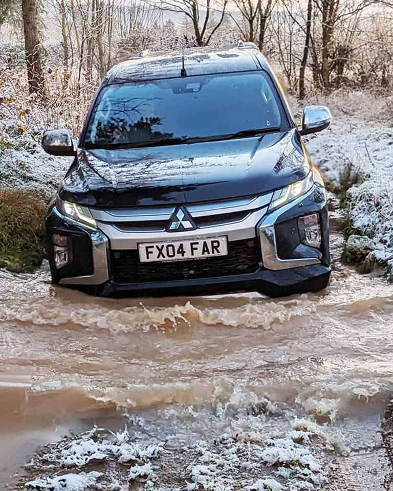 Off-road-driving-through-water-at-Winton-Castle